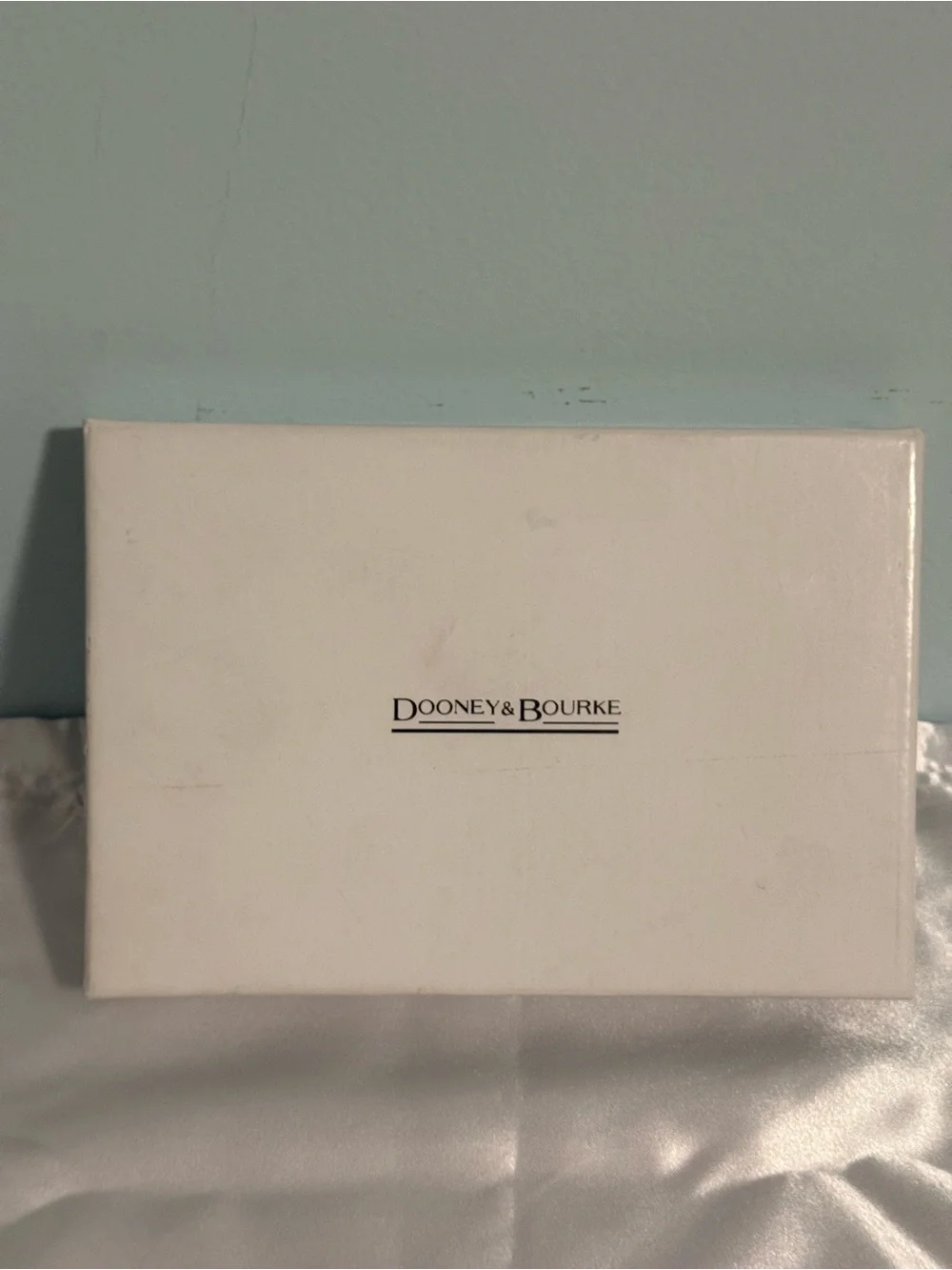 Dooney and Bourke NWT Medium logo wristlet. Comes in a box!
